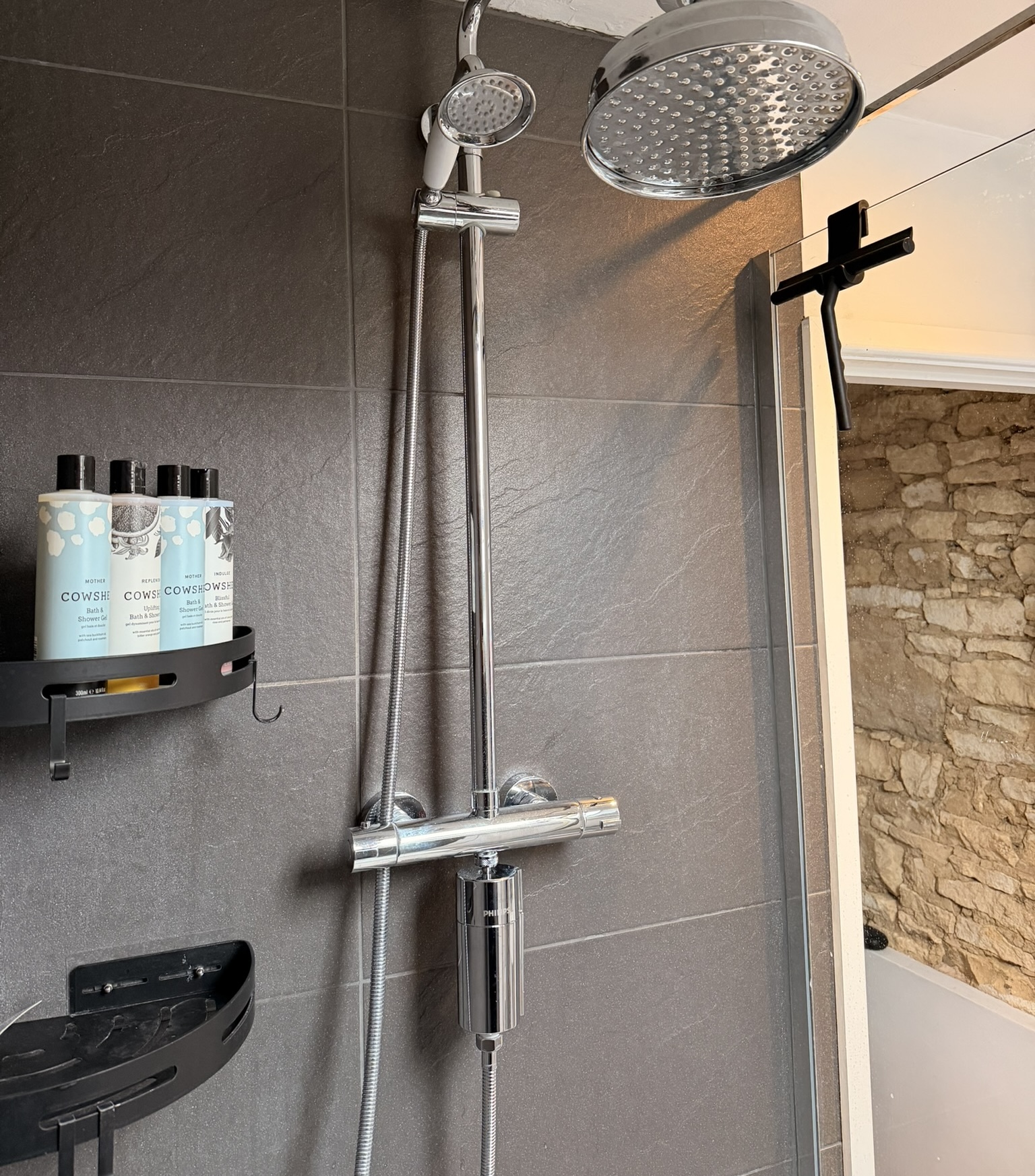 Upstairs shower fitted with a Philips in-line shower filter at Mae Cottage