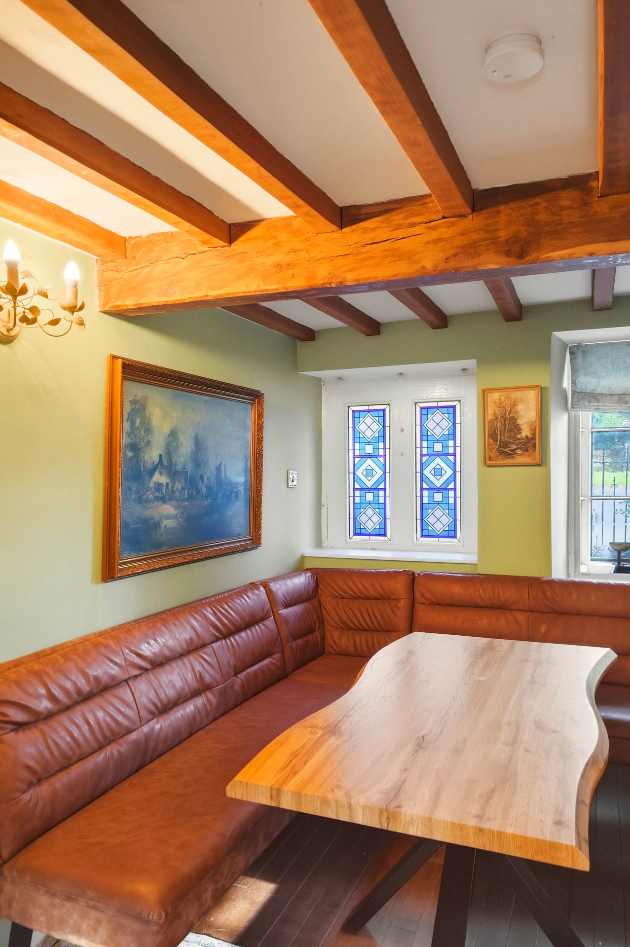 Close view of the dining nook and stained glass windows