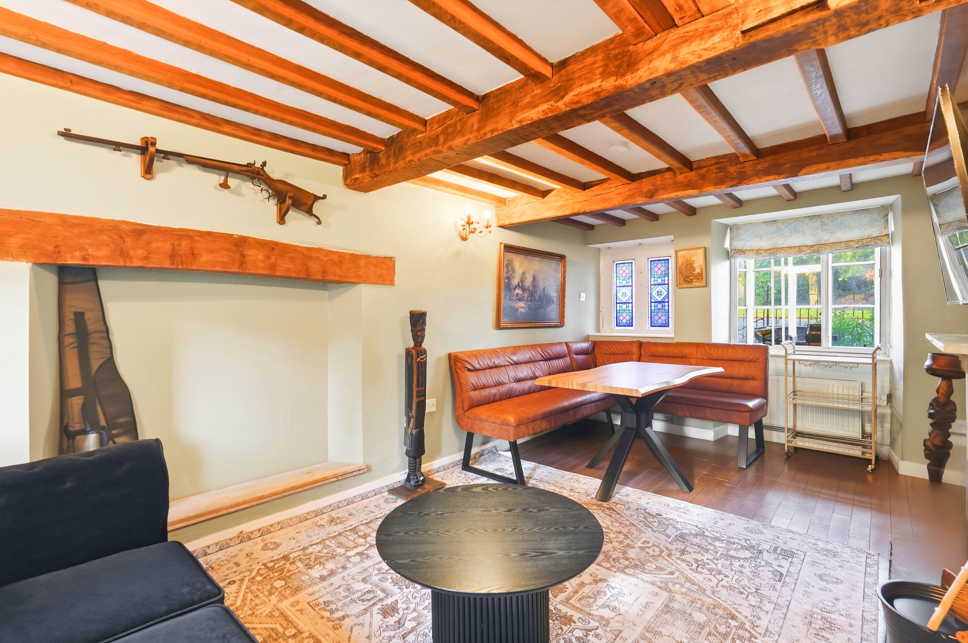 Living room detail with fireplace and beams