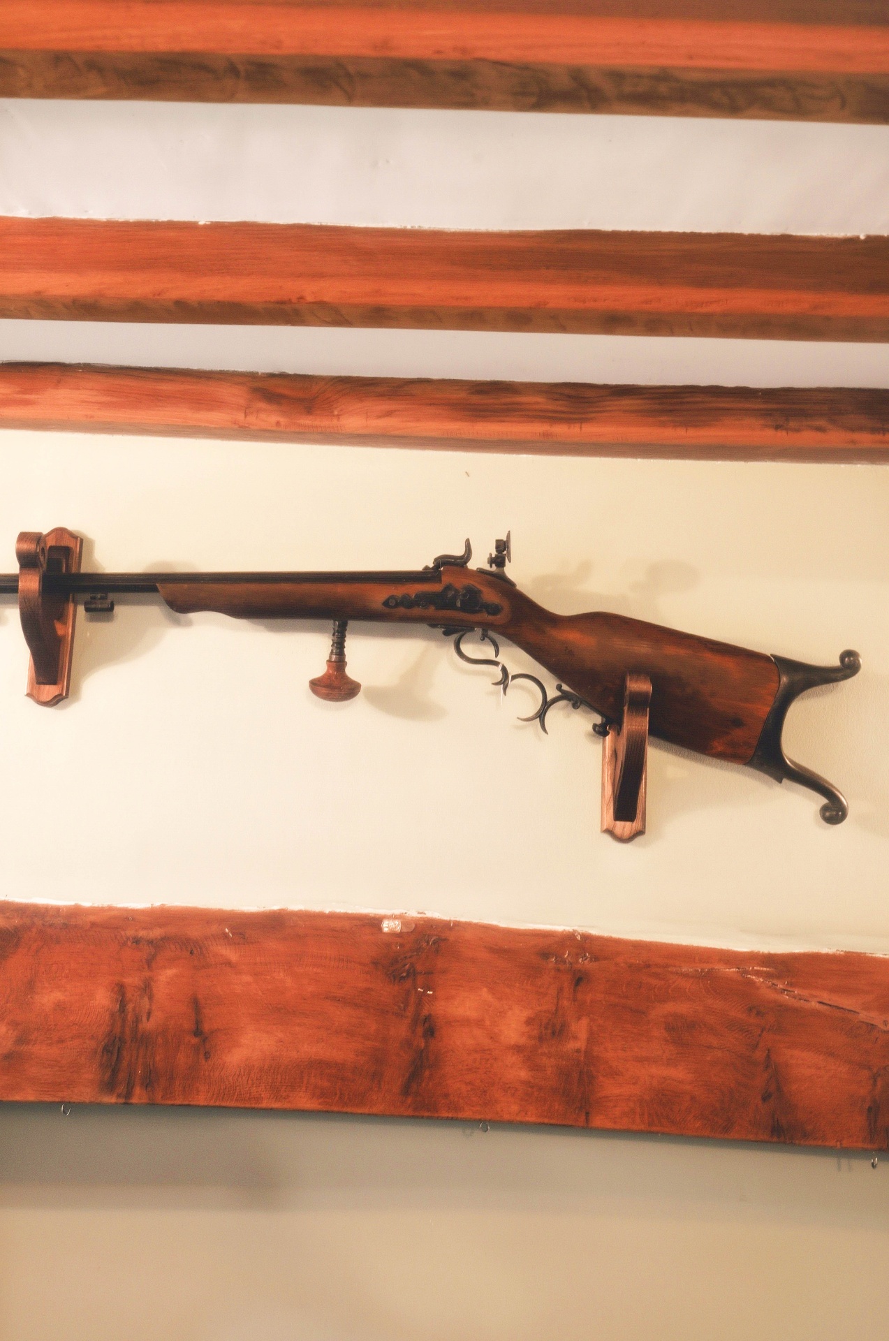 Antique rifle display mounted on the wall