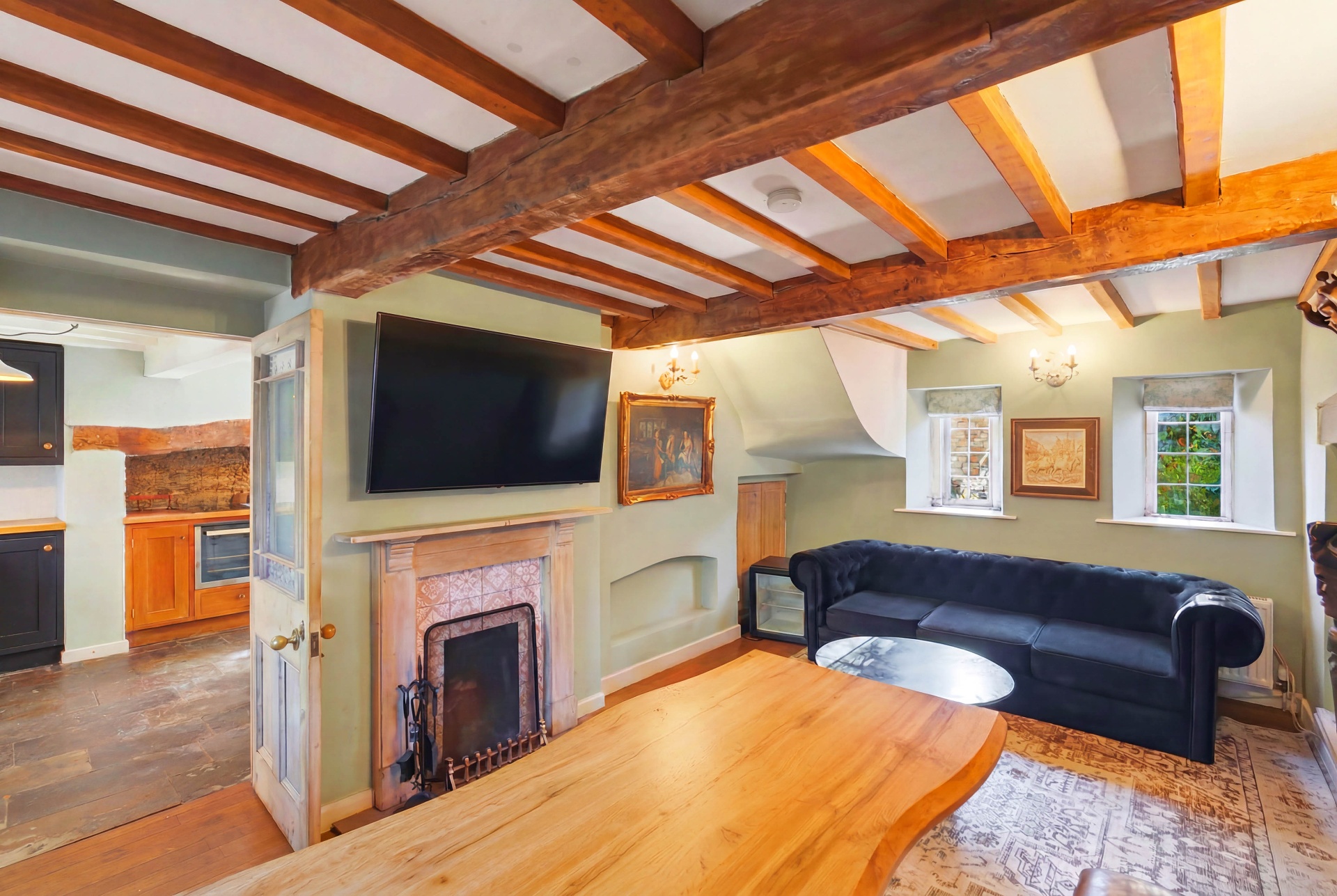 Wide view from the dining table through to the living room and kitchen