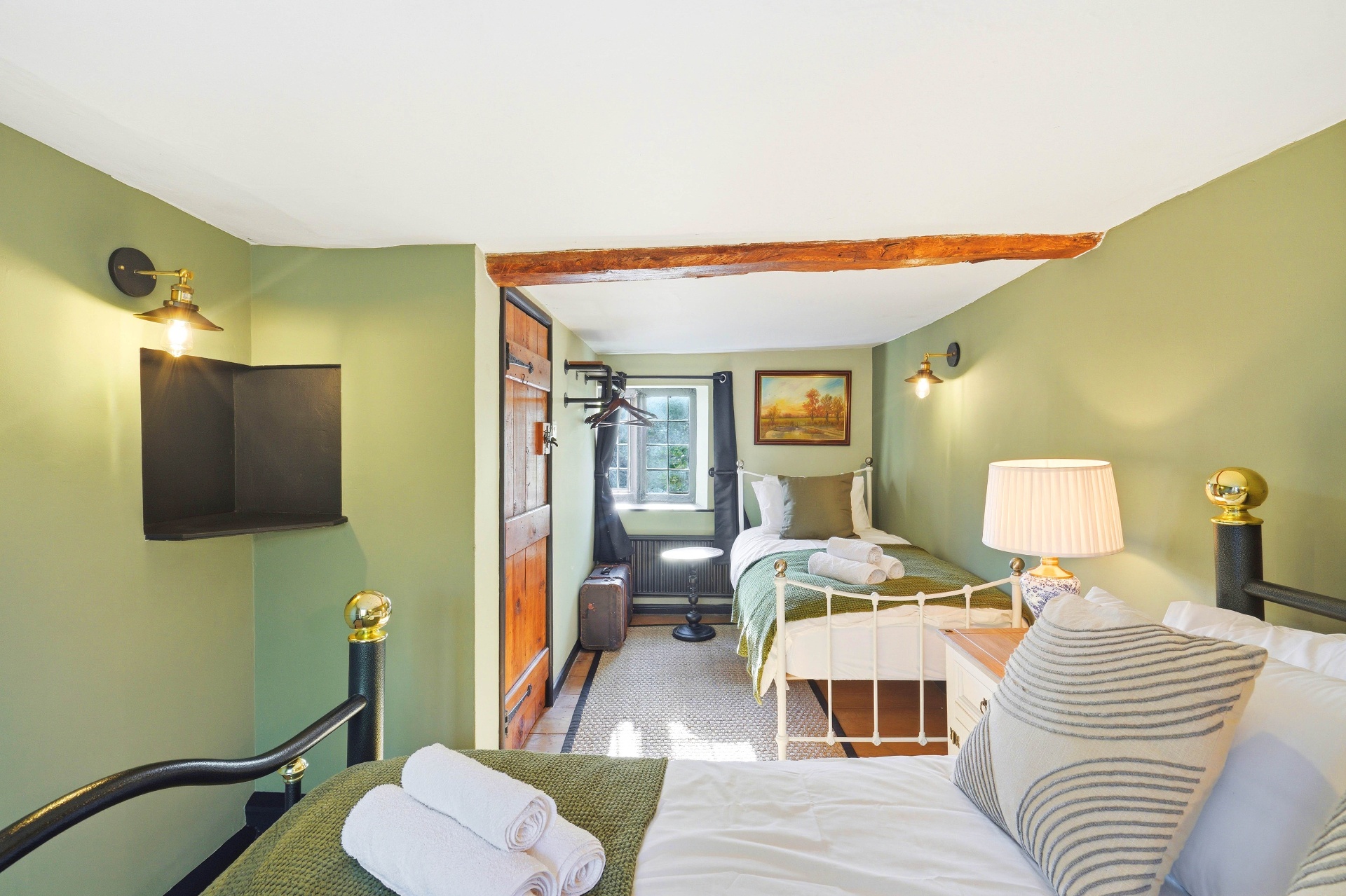 Bedroom Two wide view with original beams and cottage door