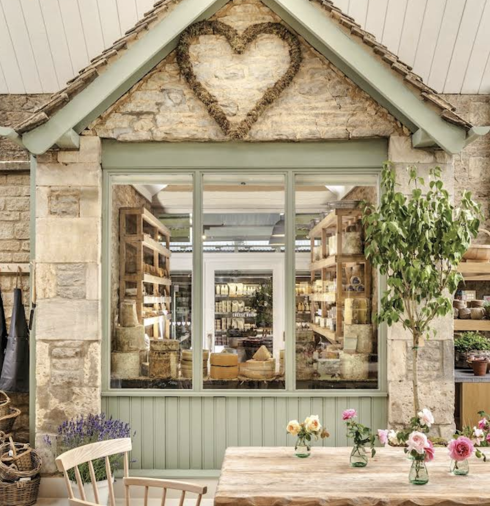 The Daylesford cheese room window with stone gable and heart detail