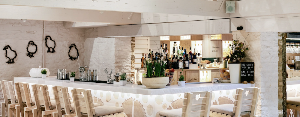 Daylesford cafe bar with white counter, juices and natural light