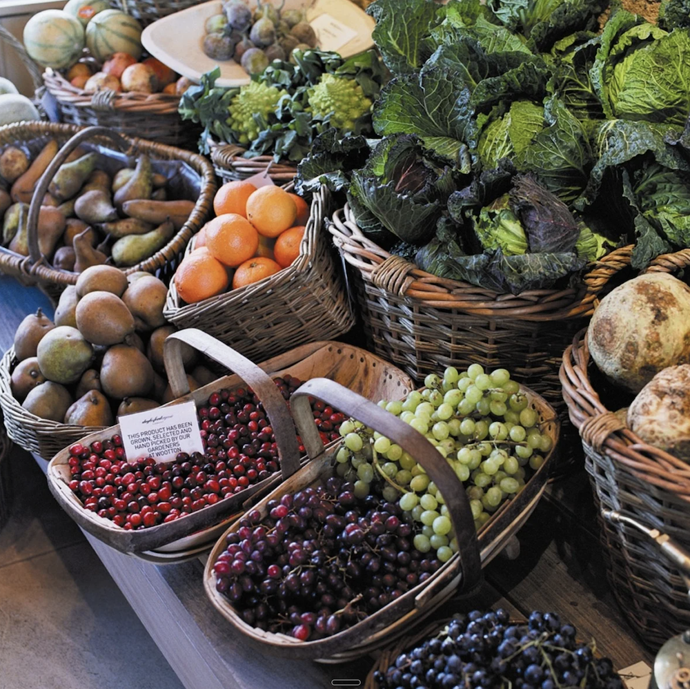Wicker baskets of seasonal organic fruit and vegetables at Daylesford